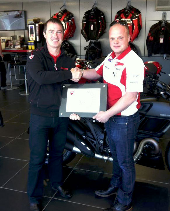 Chris Booth accepting Ducati Dealer of the Year Award